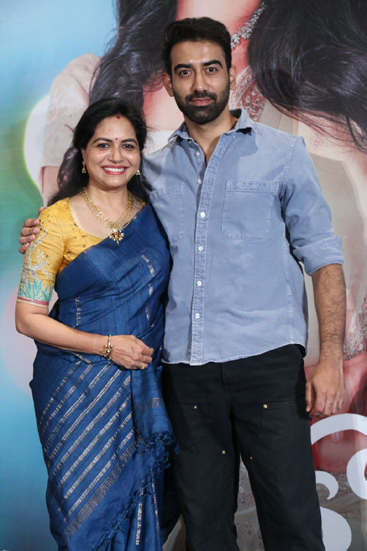 Singer Sunitha and Akash Goparaju posing together at the Kotha Malupu teaser launch.