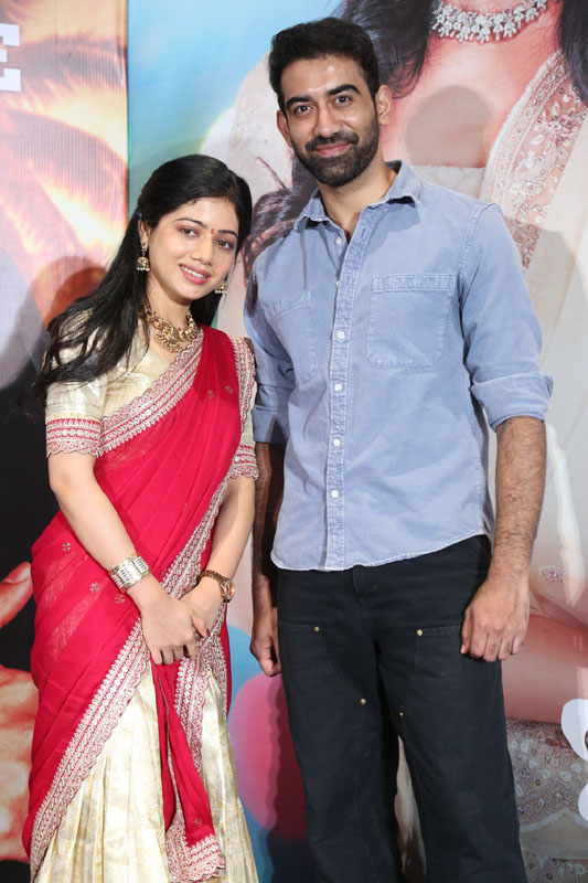 Bhairavi Ardhya and Akash Goparaju posing together at the Kotha Malupu launch event.