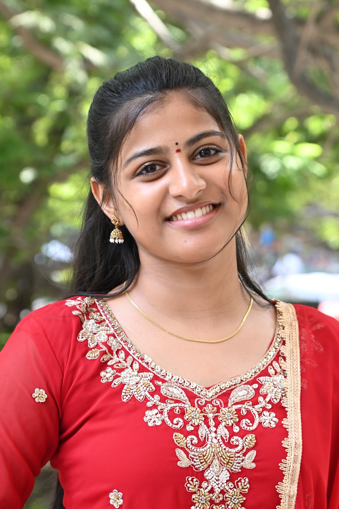 Likhitha posing in red ethnic wear