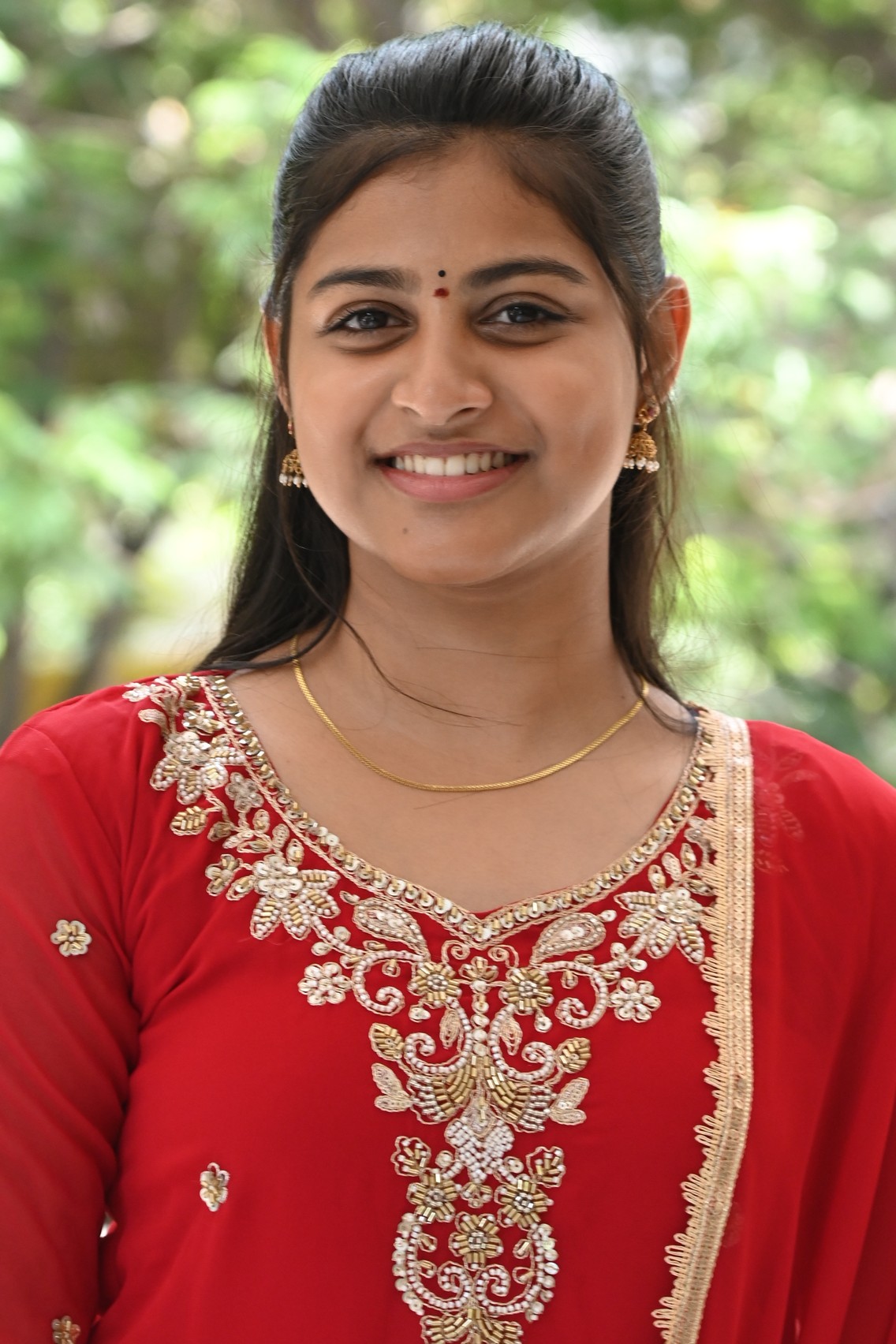 Likhitha wearing embroidered red ensemble