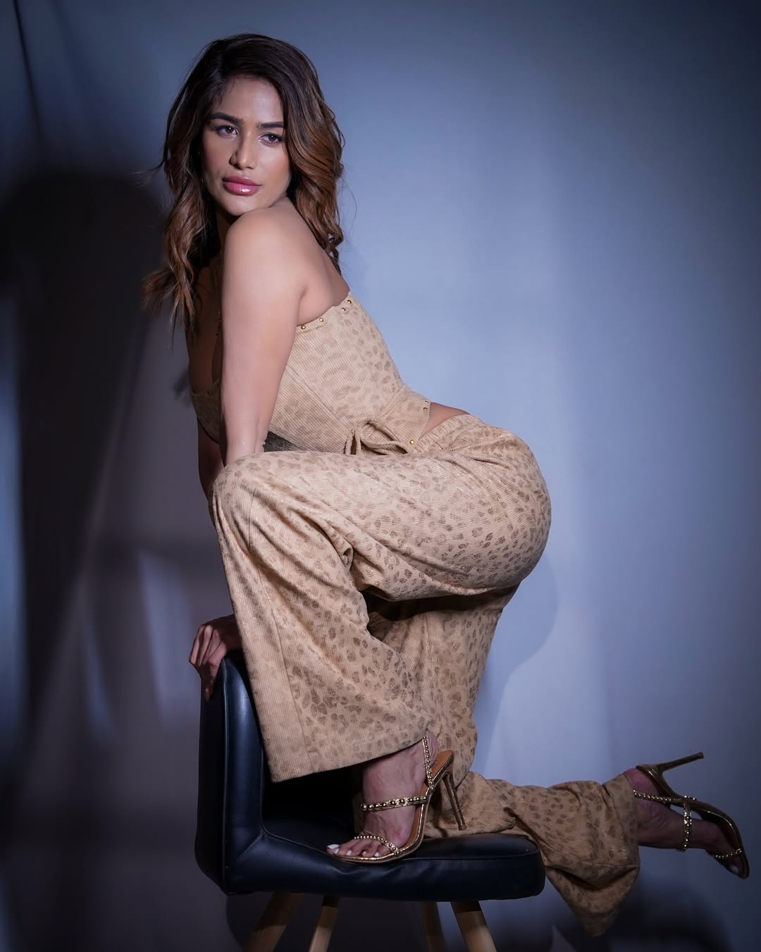 Poonam Pandey posing confidently indoors