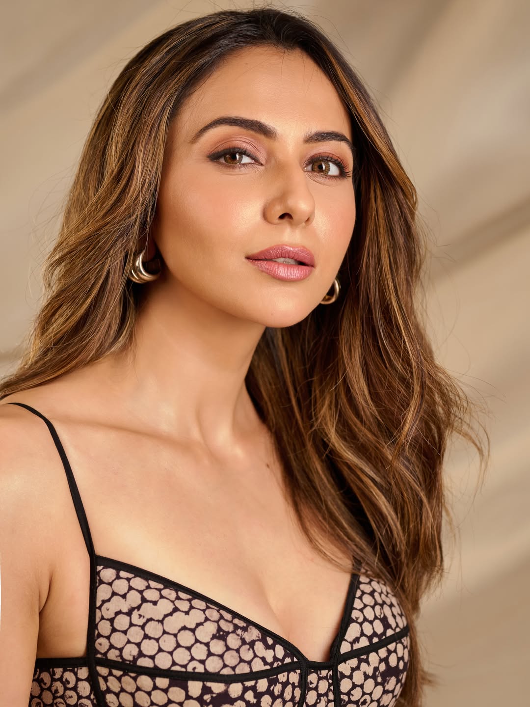 Rakul Preet Singh posing in designer dress