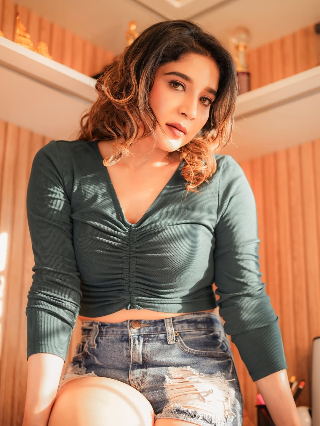 Sakshi Agarwal posing in green crop top