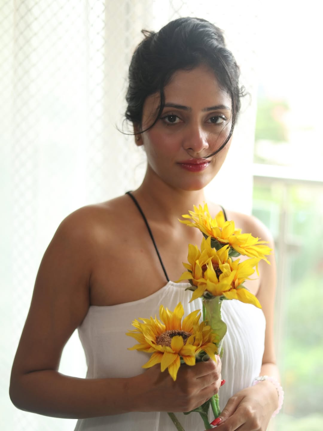 Sanya Thakur floral background elegance