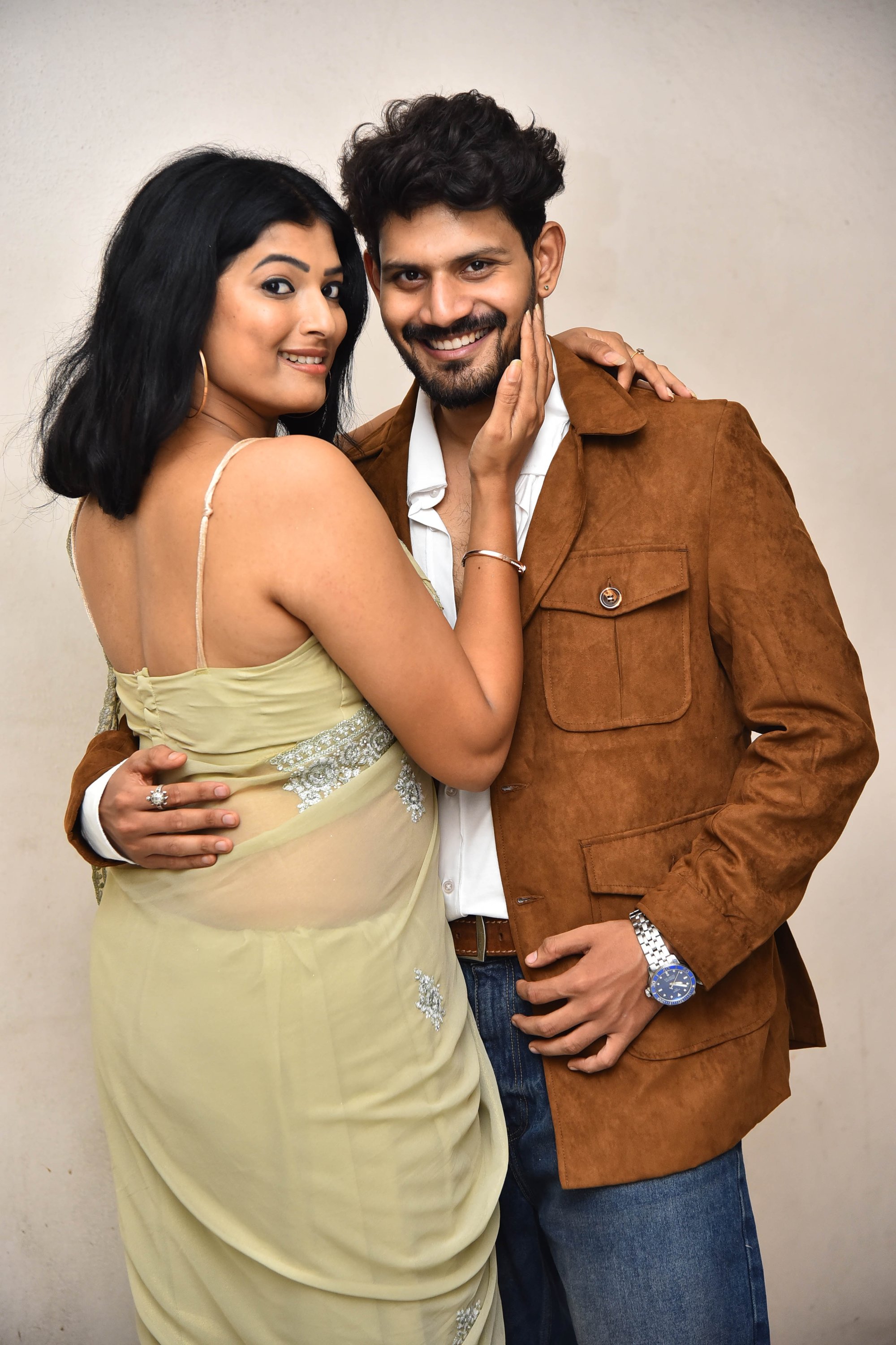 Lead pair posing for media