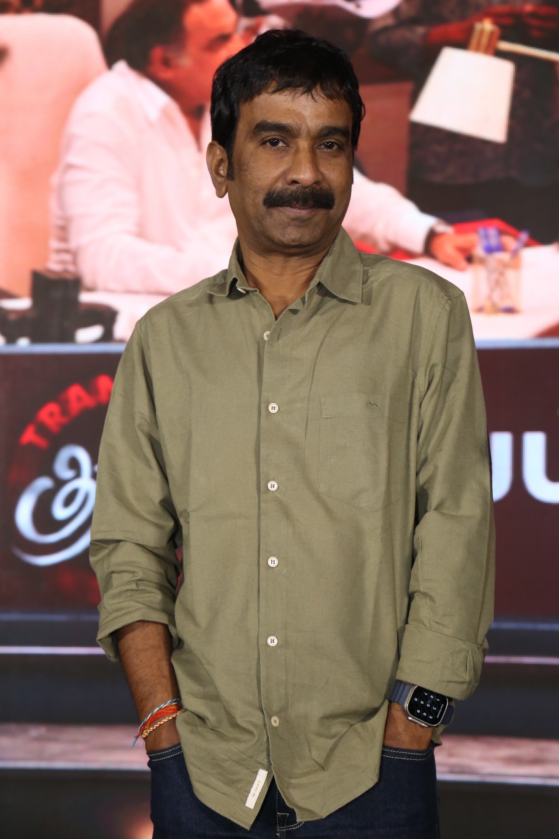Bhaskarabatla media pose at event