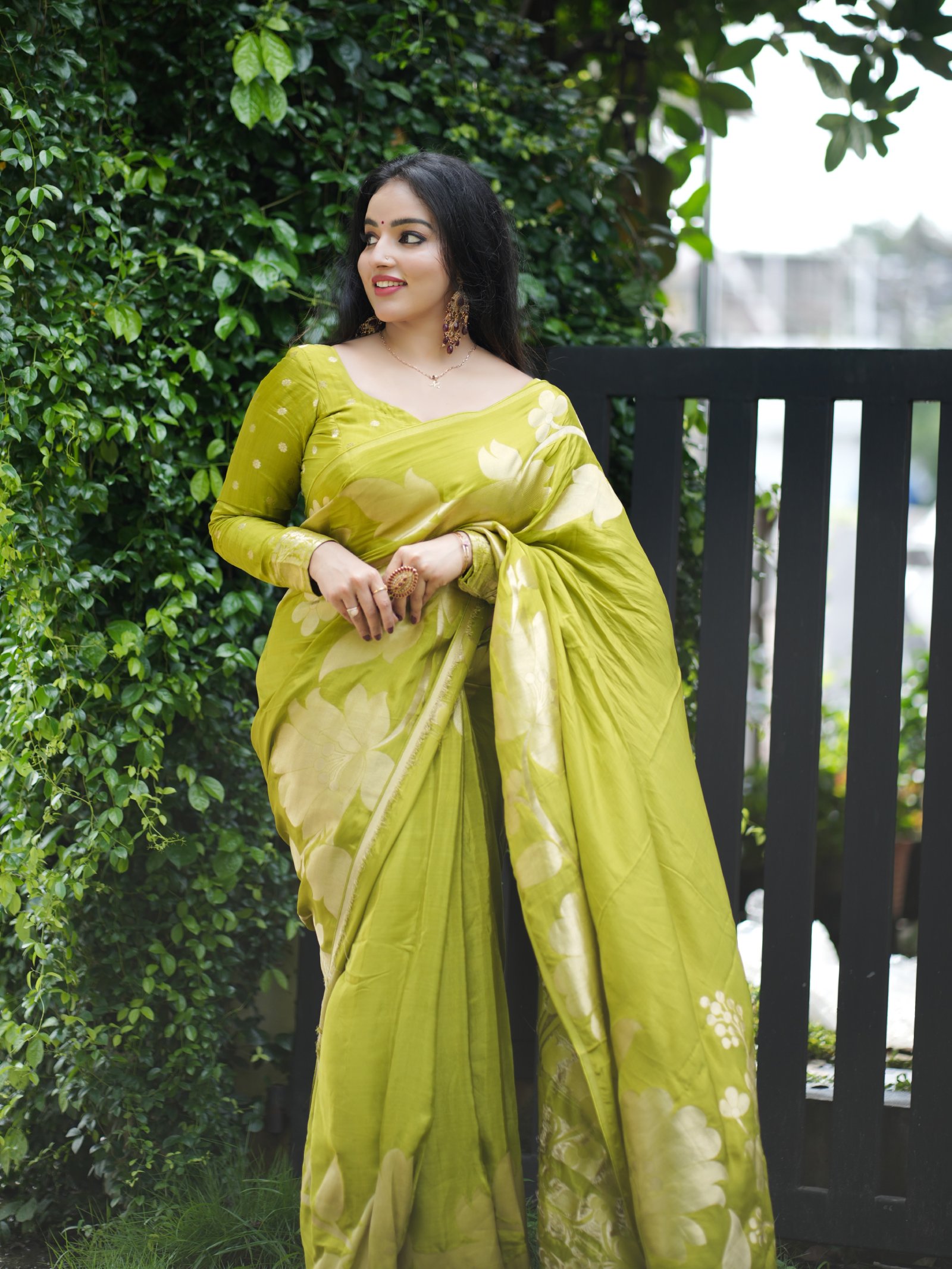 Malavika Menon smiling in saree