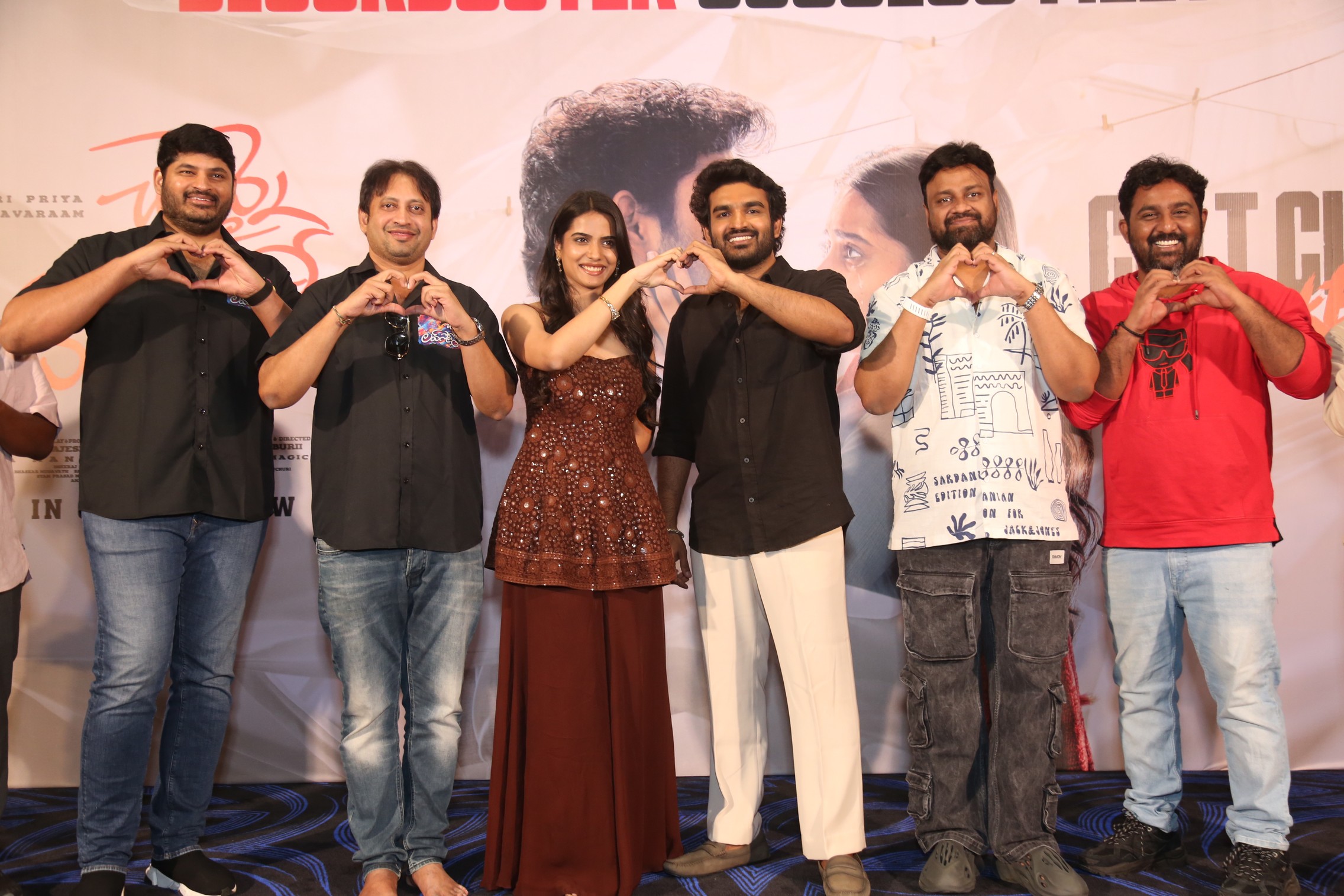 Chennai Love Story team making heart gesture at success meet