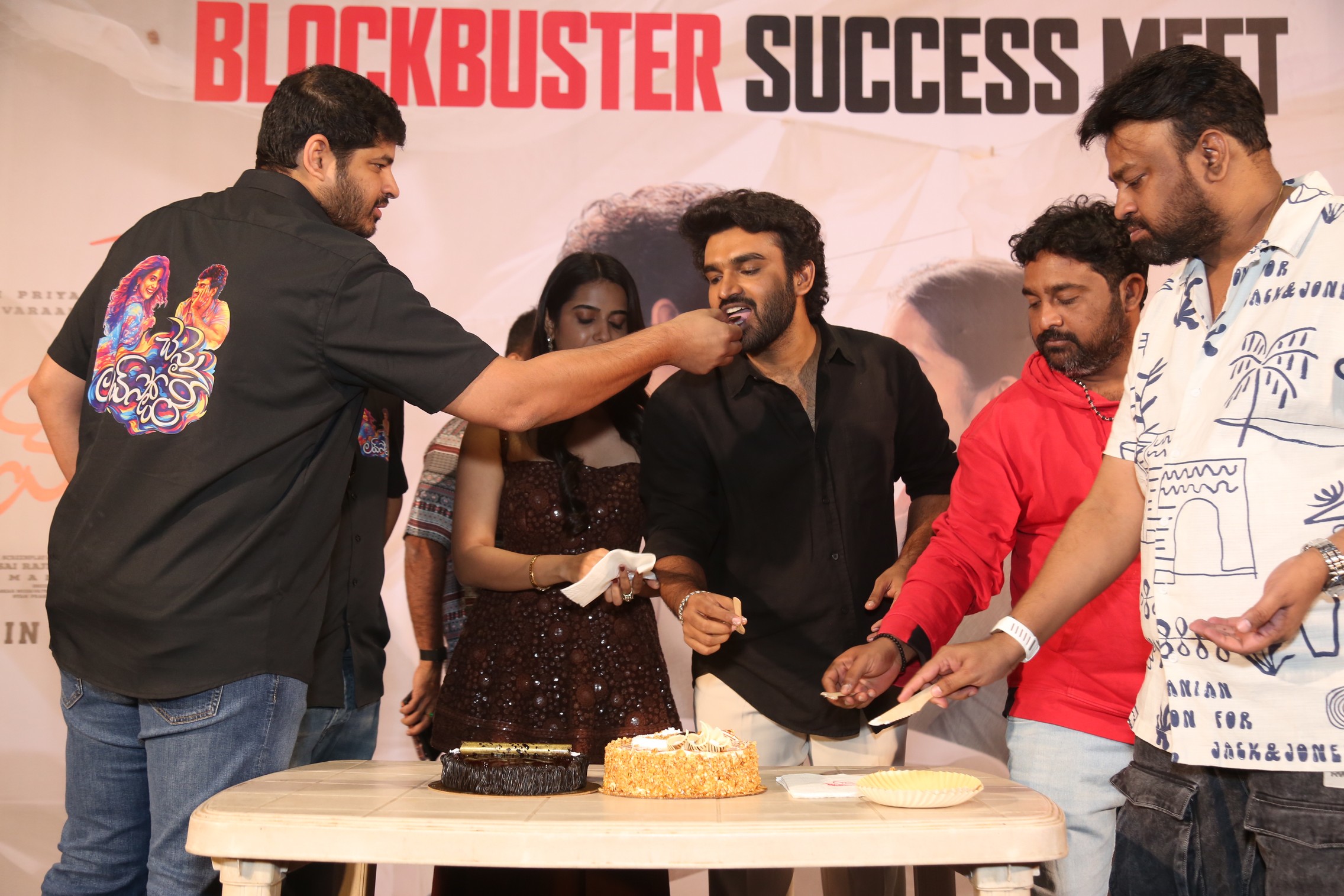 Dheeraj Mogilineni feeding cake to Kiran Abbavaraam