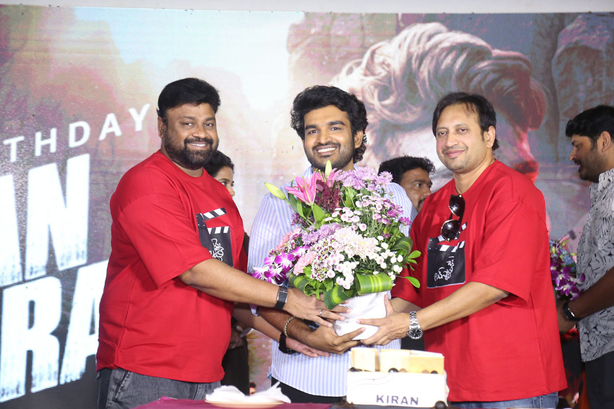 Sai Rajesh and SKN present bouquet to Kiran Abbavaram