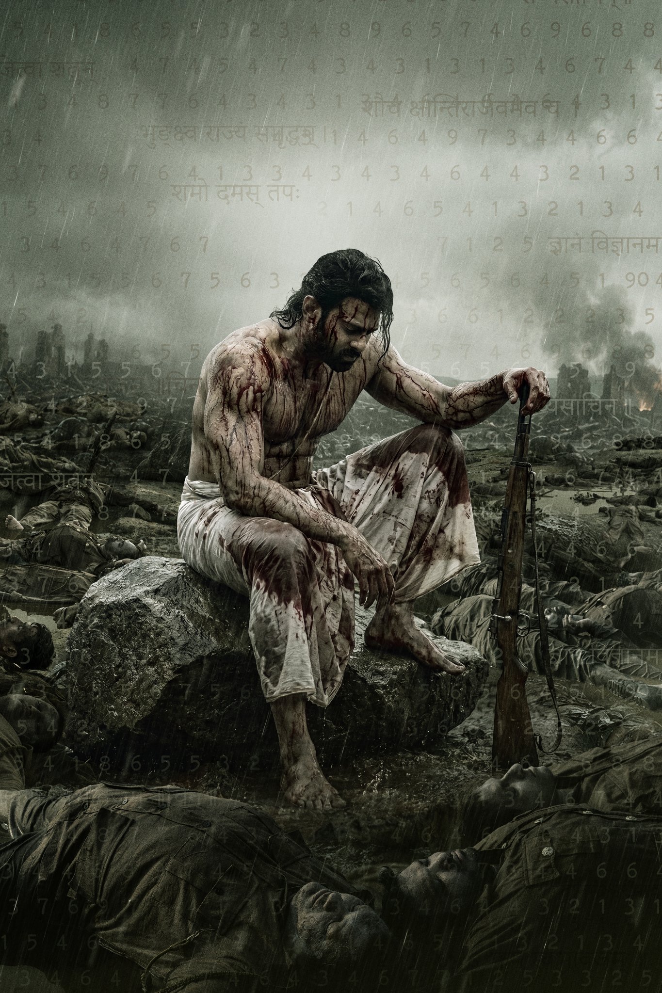 Prabhas seated on a battlefield with a rifle in the Fauzi poster.