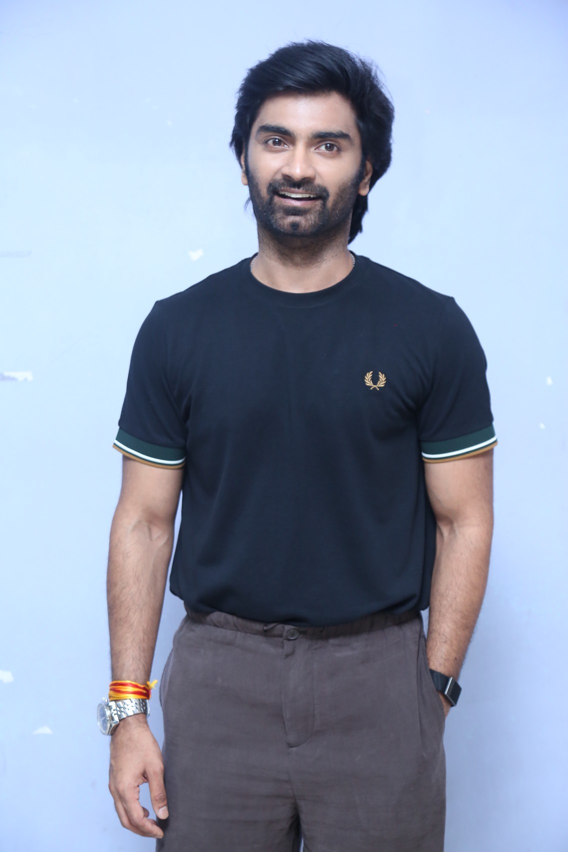 Atharvaa posing at Hrudayam Murali press meet