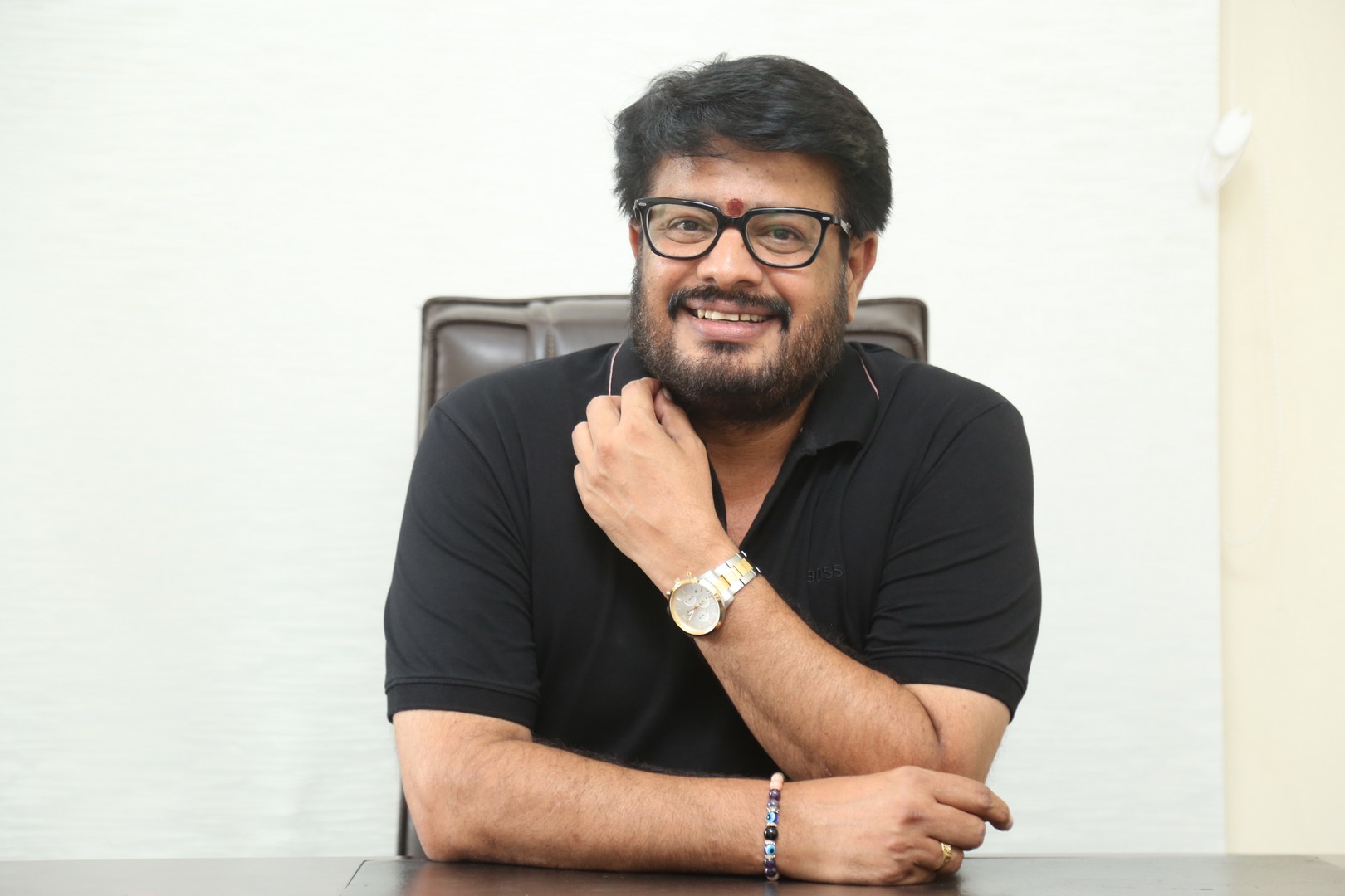 Maheswara Reddy Mooli wearing black outfit