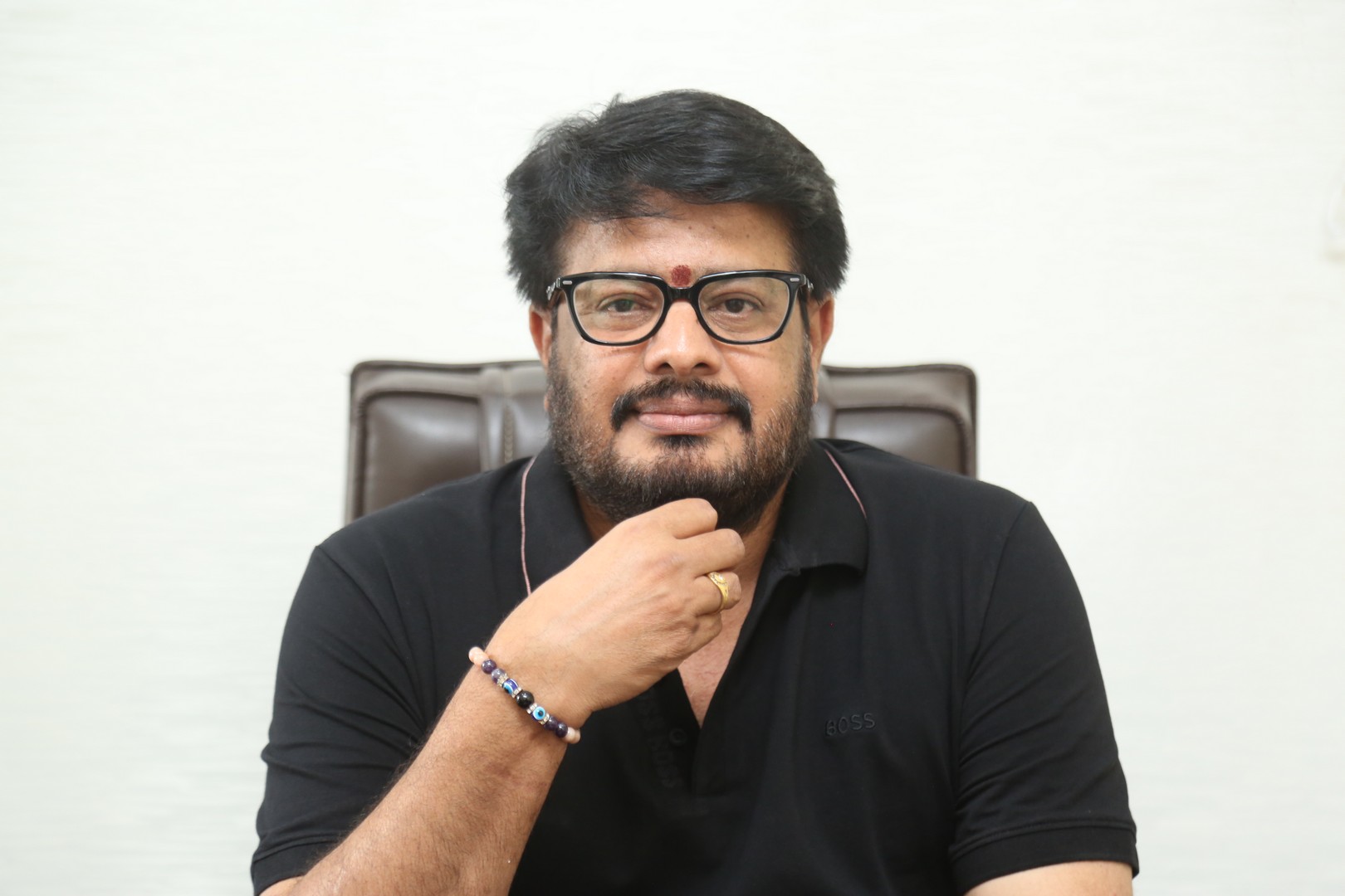 Maheswara Reddy Mooli smiling confidently