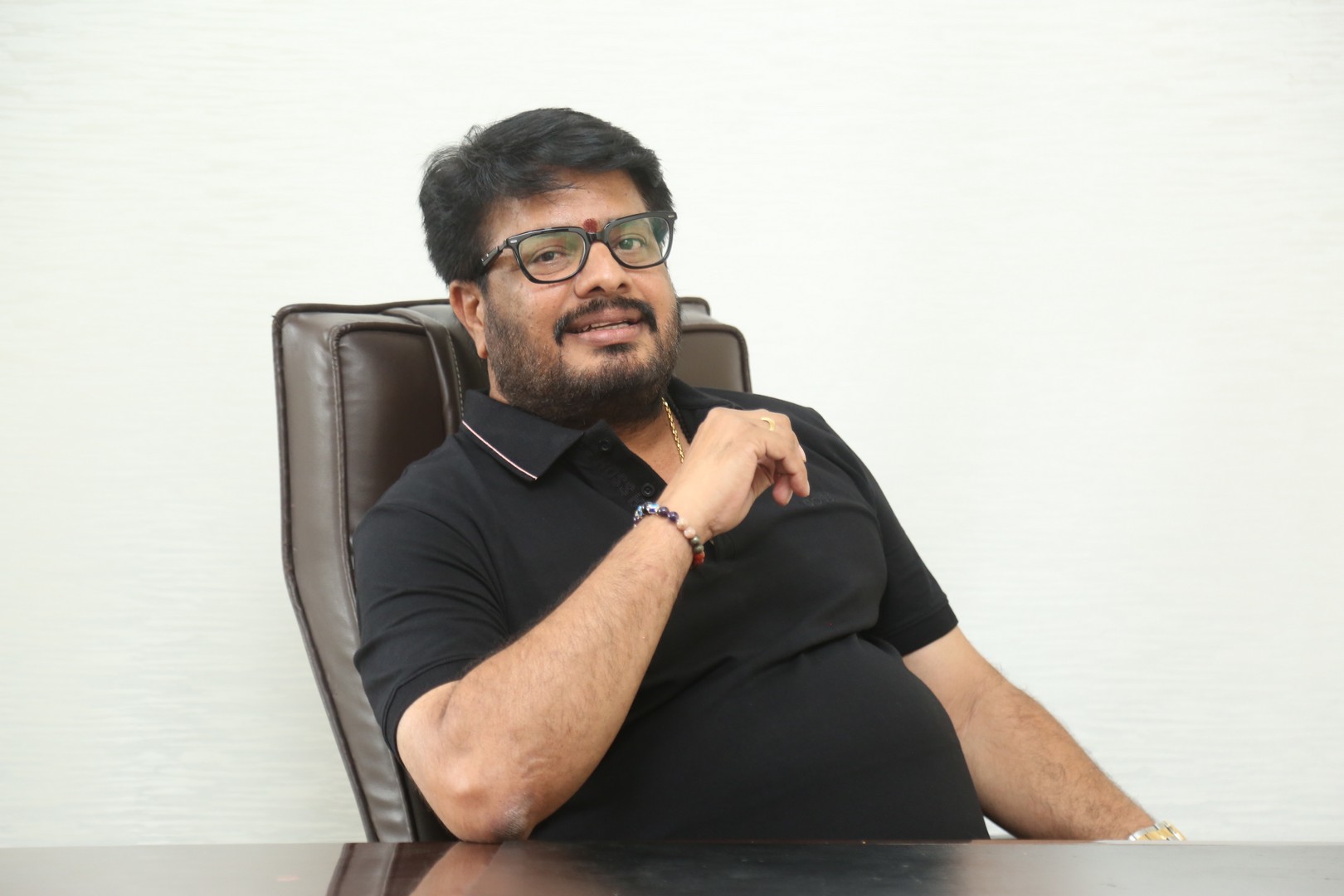 Maheswara Reddy Mooli with stylish accessories