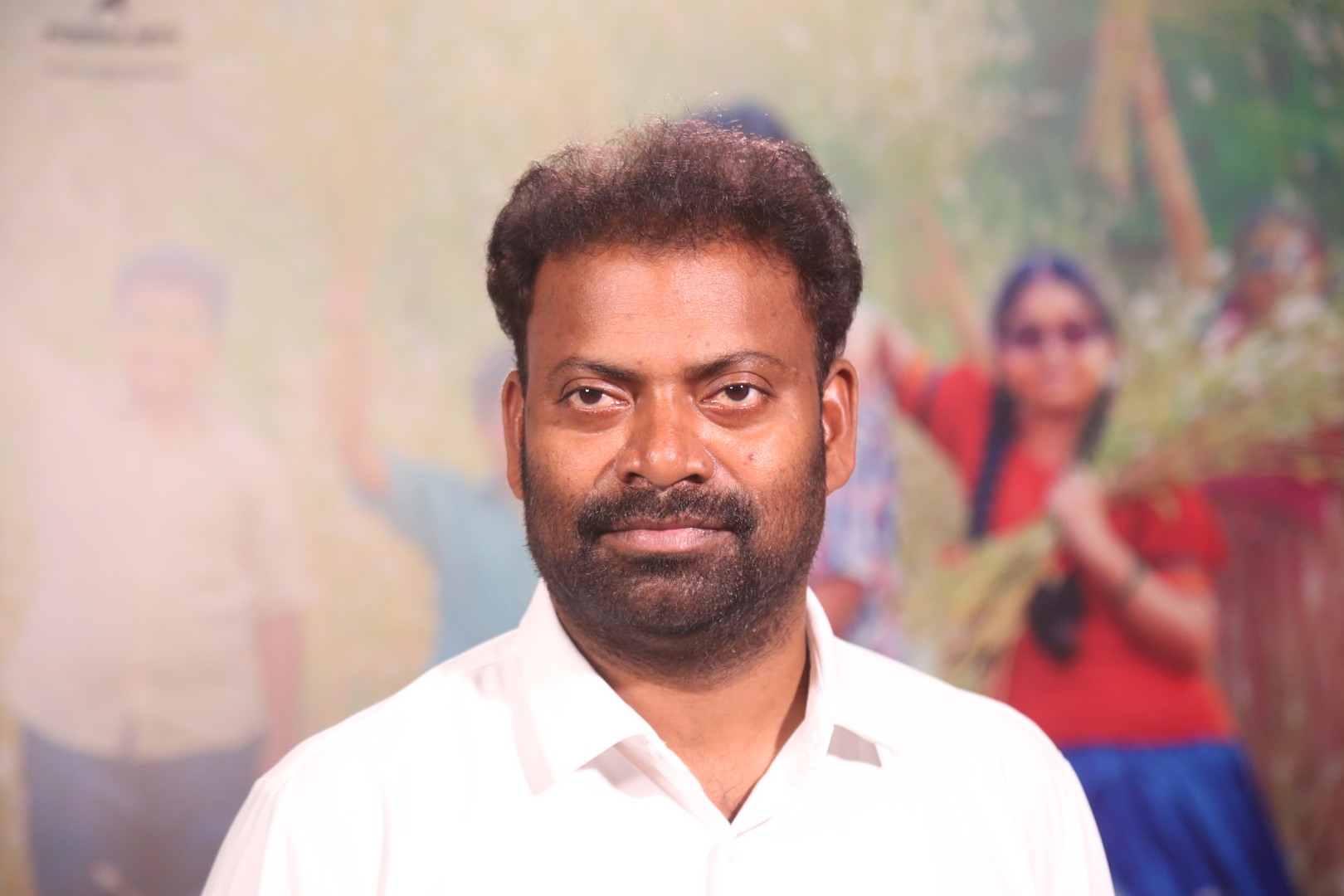 Mittapalli Surender in white shirt portrait