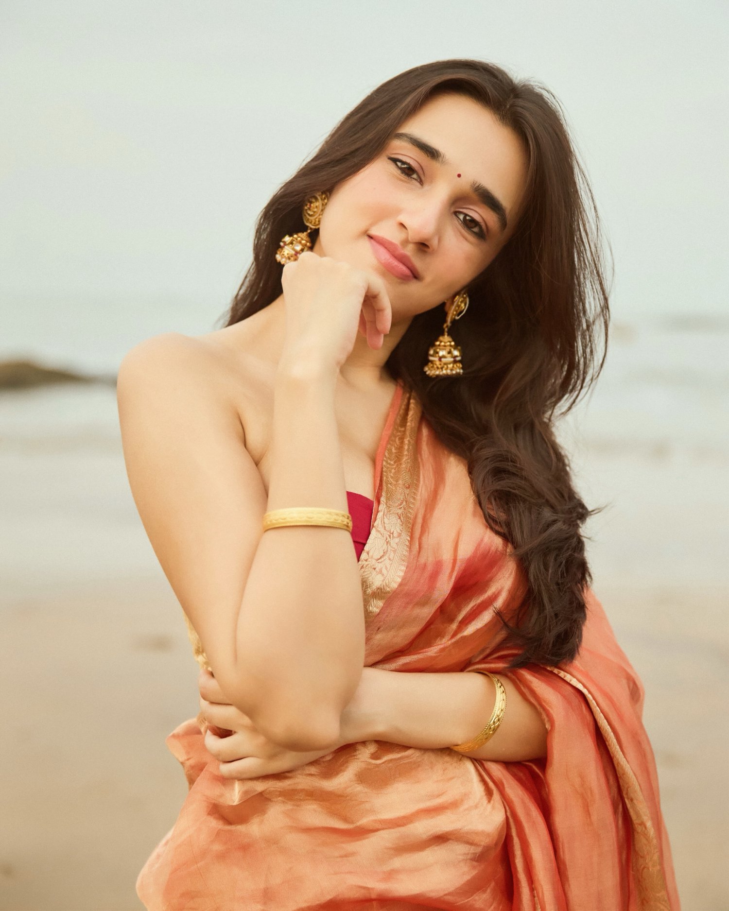 Nuveksha copper gold silk saree look