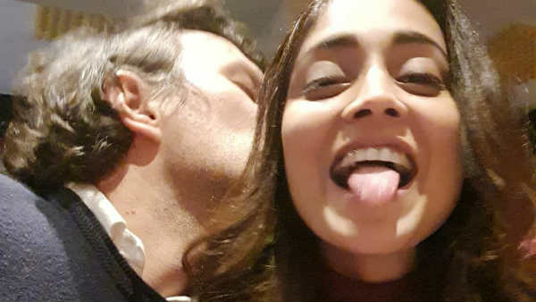  Actress shriya saran her husband kissing pics