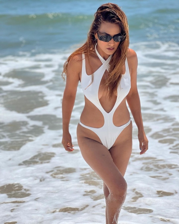 Nia Sharmas latest hot white monokini at beach photos trending 