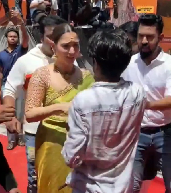 Tamannaah Bhatia shake hands and pose for a selfie with fan