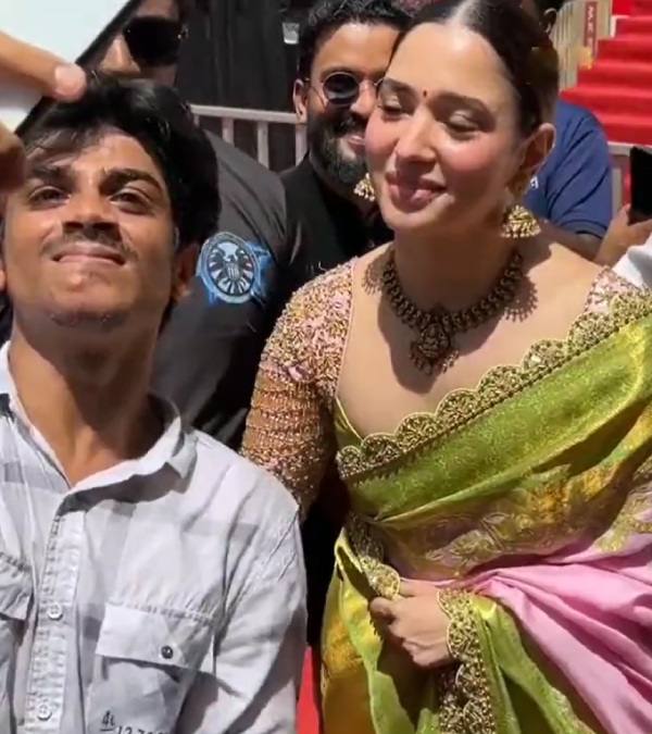Tamannaah Bhatia shake hands and pose for a selfie with fan