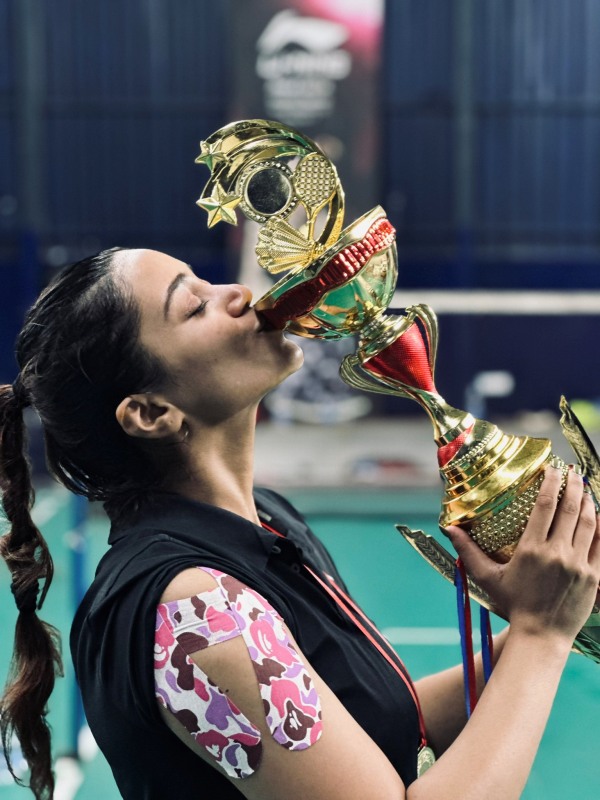 Nivetha Pethuraj won shield and trophy at Badminton game photos trending