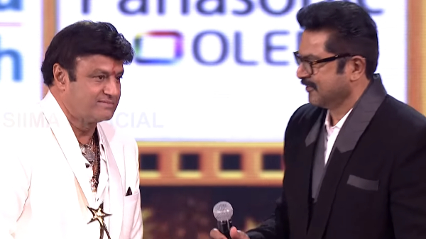 actor Balakrishna who hugged and kissed Radhika on stage and Sarathkumar s action