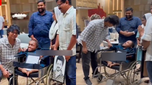 Actor Vijay takes a photo with disabled fan at kerala