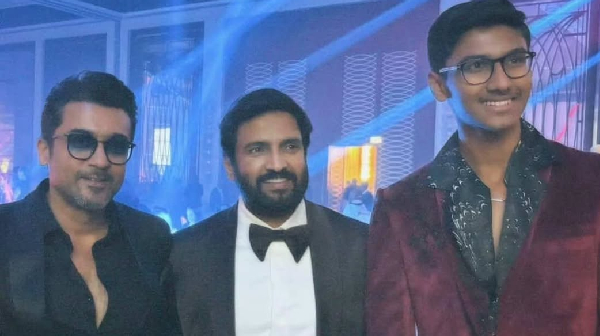 Santhanam s Son Nipun poses with Actor Suriya at a function photo goes trending