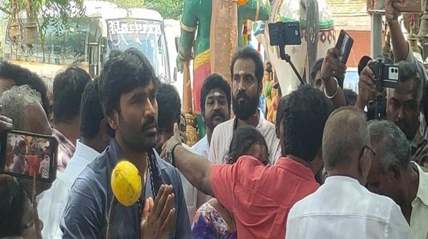 Dhanush slaughters a goat and hosts a feast for his hometown people