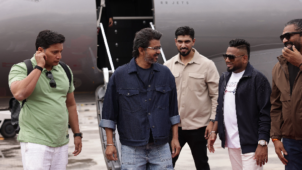 Vijay holding a speaker at Malaysia Airport vows fans