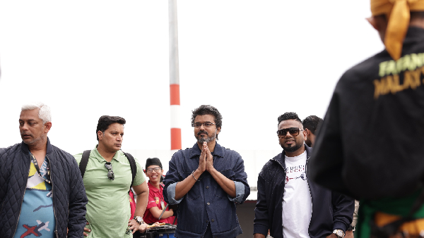 Vijay holding a speaker at Malaysia Airport vows fans