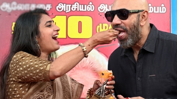 Sathyaraj feeds Halwa to Kasthuri at Amaithipadai re release promotional event Sathyaraj feeds Halwa to Kasthuri at Amaithipadai re release promotional event