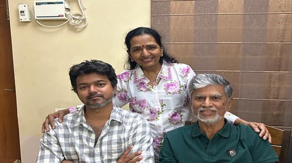 SAC Stands Like a Stranger Vijay s Father Spotted During TVK Campaign