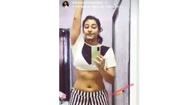 టాప్ లేపేసి షాకిచ్చింది.. అద్దం ముందు