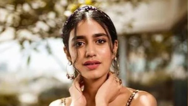 తనవైపుకు తిప్పుకుని..