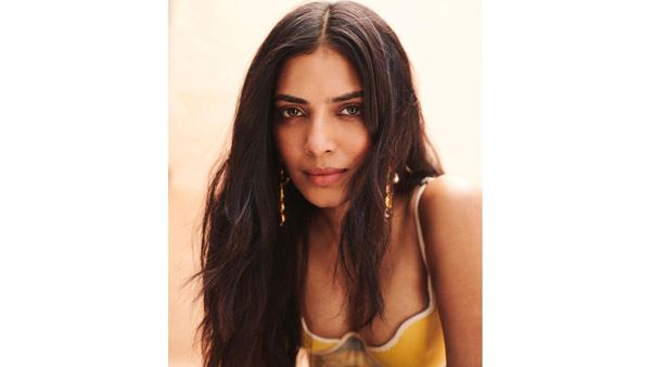 Malavika Mohanan Sizzling Look In Latest Yellow Colour Sleeveless Top