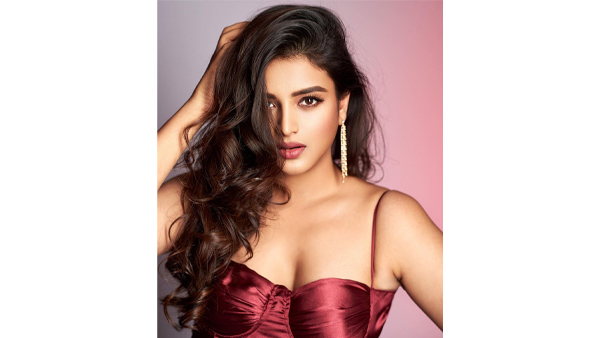 Nidhi Agerwal Stunning Looks In Latest Maroon Sleeveless Dress