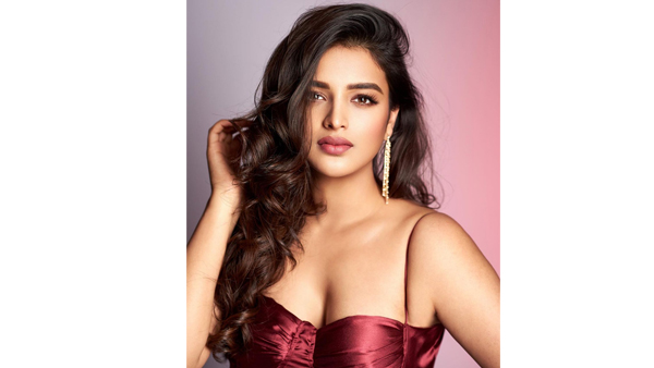 Nidhi Agerwal Stunning Looks In Latest Maroon Sleeveless Dress