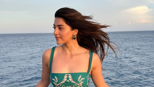 Actress Mehreen Pirzada Looks Sizzling In Her Green Dress at Beach Vacation