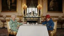 Queen Elizabeth Appears Alongside Paddington Bear, Reveals What’s In Her Famous Handbag: WATCH